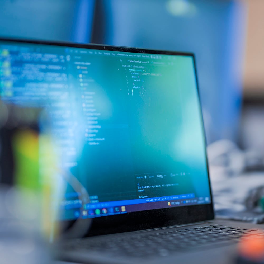 Laptop showing software development code